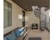 Relaxing outdoor patio with comfortable seating, privacy, and unique spiral staircase access at 2672 Mystere Ct, Las Vegas, NV 89117