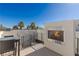 Outdoor fireplace feature and roof access on the top deck at 2672 Mystere Ct, Las Vegas, NV 89117