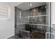 Glass walk-in shower features seating, dark grey tile, and recessed lighting at 2672 Mystere Ct, Las Vegas, NV 89117