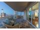 Expansive balcony featuring comfortable wicker furniture, tile flooring, and Strip views at 2777 Paradise Rd # 1105, Las Vegas, NV 89109