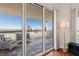 Balcony with striped outdoor furniture and views of the Strip and the Sahara Hotel and Casino at 2777 Paradise Rd # 1105, Las Vegas, NV 89109