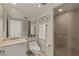 Modern bathroom featuring a glass shower, vanity, and a large mirror at 2777 Paradise Rd # 1105, Las Vegas, NV 89109