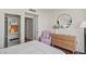 Well-lit bedroom featuring wood floors, a closet, and a cozy seating area at 2777 Paradise Rd # 1105, Las Vegas, NV 89109