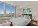Bright bedroom featuring floor-to-ceiling windows with city views, hardwood flooring, and contemporary decor at 2777 Paradise Rd # 1105, Las Vegas, NV 89109