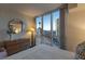 Serene bedroom with city views through large windows and sleek, modern dresser at 2777 Paradise Rd # 1105, Las Vegas, NV 89109