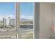 This bedroom boasts an expansive view of the city, mountains, and nearby buildings at 2777 Paradise Rd # 1105, Las Vegas, NV 89109