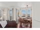 Dining room with hardwood floors, a modern light fixture, and city views through large windows at 2777 Paradise Rd # 1105, Las Vegas, NV 89109
