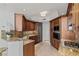 Stylish kitchen with granite countertops, stainless steel appliances, and wood cabinetry at 2777 Paradise Rd # 1105, Las Vegas, NV 89109