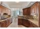 Gourmet kitchen with granite countertops, stainless steel appliances, and breakfast nook with city views at 2777 Paradise Rd # 1105, Las Vegas, NV 89109