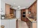 Modern kitchen with granite countertops, stainless steel appliances, and light wood cabinets at 2777 Paradise Rd # 1105, Las Vegas, NV 89109
