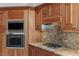 Modern kitchen features stainless steel appliances, granite countertops, and stylish wooden cabinetry at 2777 Paradise Rd # 1105, Las Vegas, NV 89109