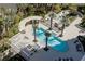 Luxury pool area with lounge chairs and cabanas nestled among swaying palm trees and landscaping at 2777 Paradise Rd # 1105, Las Vegas, NV 89109
