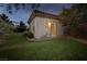 Exterior view of a shed with a tile roof and green lawn in the backyard at 2900 Valvent Ct, Henderson, NV 89044