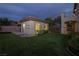View of the backyard featuring an outbuilding on a manicured lawn at 2900 Valvent Ct, Henderson, NV 89044
