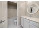 Bright bathroom features a vanity with ample counter space, and a combined shower and tub, with tiled flooring at 2900 Valvent Ct, Henderson, NV 89044