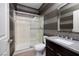 Contemporary bathroom with glass shower, granite countertop, and modern fixtures at 2900 Valvent Ct, Henderson, NV 89044