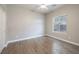 Bright bedroom features wood-look flooring, a window, and closet for ample storage at 2900 Valvent Ct, Henderson, NV 89044