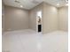 Large empty bedroom featuring tile flooring and an ensuite bathroom at 2900 Valvent Ct, Henderson, NV 89044