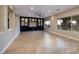 Bright bonus room with custom built-ins, recessed lighting, and large windows overlooking the pool at 2900 Valvent Ct, Henderson, NV 89044
