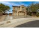 Charming two-story home with a three-car garage, a stucco exterior, and attractive landscaping at 2900 Valvent Ct, Henderson, NV 89044