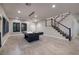 Bright and airy game room with a pool table, modern staircase, and wood-style flooring at 2900 Valvent Ct, Henderson, NV 89044