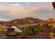 Beautiful mountain view overlooking rooftops in a tranquil neighborhood at 2900 Valvent Ct, Henderson, NV 89044