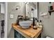 Stylish bathroom featuring a modern vessel sink on a wooden countertop and updated fixtures at 301 E Van Wagenen St, Henderson, NV 89015