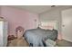 Cozy bedroom with a comfortable bed, stylish headboard, and soft, inviting colors and textures at 301 E Van Wagenen St, Henderson, NV 89015