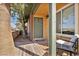 Charming front porch with seating, offering a cozy outdoor welcome to the home at 301 E Van Wagenen St, Henderson, NV 89015