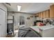 Functional kitchen with ample counter space and stainless-steel appliances, adjacent to back door at 301 E Van Wagenen St, Henderson, NV 89015