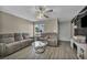 Bright living room with wood-look floors, neutral tones, and comfortable seating arrangement at 301 E Van Wagenen St, Henderson, NV 89015