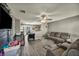 Cozy living room featuring wood-look floors and a modern ceiling fan at 301 E Van Wagenen St, Henderson, NV 89015