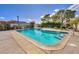 Community pool surrounded by lush trees, offering a refreshing escape on sunny days at 301 E Van Wagenen St, Henderson, NV 89015