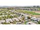 This aerial shot captures the beautiful homes, landscaping, and golf course of the community at 304 Cambrian Ridge Ct, Las Vegas, NV 89144