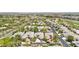 An aerial shows the community, with lush trees, well-kept streets, and beautiful desert landscaping at 304 Cambrian Ridge Ct, Las Vegas, NV 89144