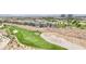 A scenic aerial view shows the homes bordering a golf course within the community at 304 Cambrian Ridge Ct, Las Vegas, NV 89144