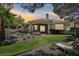 A gorgeous backyard provides ample space for outdoor living, complete with lush green grass and stone landscaping at 304 Cambrian Ridge Ct, Las Vegas, NV 89144