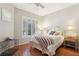 This bedroom offers natural light with shutters, hardwood floors, and neutral paint colors at 304 Cambrian Ridge Ct, Las Vegas, NV 89144