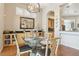 Cozy dining room featuring hardwood floors, classic furnishings, and a built-in serving bar at 304 Cambrian Ridge Ct, Las Vegas, NV 89144