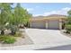 A charming, well-kept home with a spacious driveway and desert landscaping at 304 Cambrian Ridge Ct, Las Vegas, NV 89144