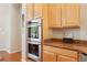 The kitchen includes stainless steel double ovens and maple cabinets, providing a stylish and functional cooking space at 304 Cambrian Ridge Ct, Las Vegas, NV 89144