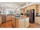 This spacious kitchen features an island, granite countertops, stainless steel appliances, and ample cabinet space at 304 Cambrian Ridge Ct, Las Vegas, NV 89144