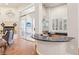 Open concept living with bar area, hardwood flooring, and backyard access at 304 Cambrian Ridge Ct, Las Vegas, NV 89144