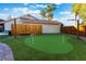 Backyard putting green featuring artificial turf and flag poles at 3099 Palmdesert Way, Las Vegas, NV 89120