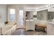 Spa-like bathroom with a soaking tub, a walk-in shower, and modern fixtures at 3099 Palmdesert Way, Las Vegas, NV 89120