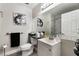 Practical bathroom showcasing a single vanity, ample mirror space and a shower at 3099 Palmdesert Way, Las Vegas, NV 89120