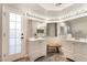 Bright bathroom featuring dual vanities, a large mirror, and ample counter space at 3099 Palmdesert Way, Las Vegas, NV 89120