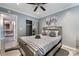 Well-lit bedroom with closet, stylish décor and cozy modern bed at 3099 Palmdesert Way, Las Vegas, NV 89120