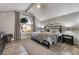 Stylish bedroom with a vaulted ceiling, a plush bed, and a large window with views of the outdoors at 3099 Palmdesert Way, Las Vegas, NV 89120