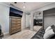 Bedroom with ceiling fan, TV, dresser, mirrored closet and futon sofa at 3099 Palmdesert Way, Las Vegas, NV 89120
